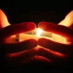 prayer candles hands